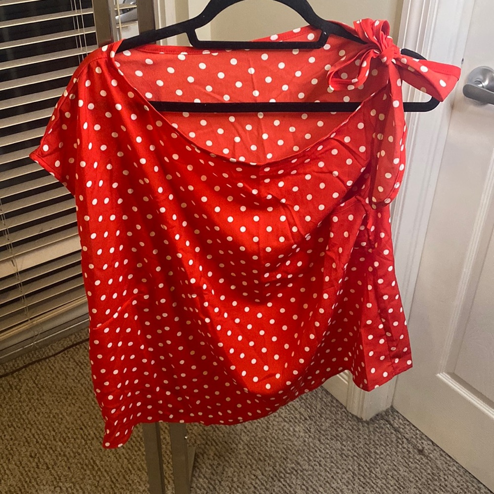 Polka dot shirt.